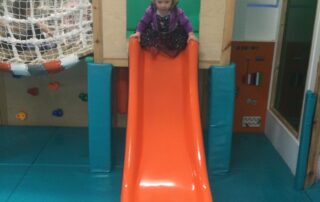 nursery child on our indoor slide