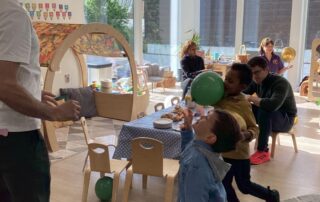 Children playing with balloons at Melody Lane